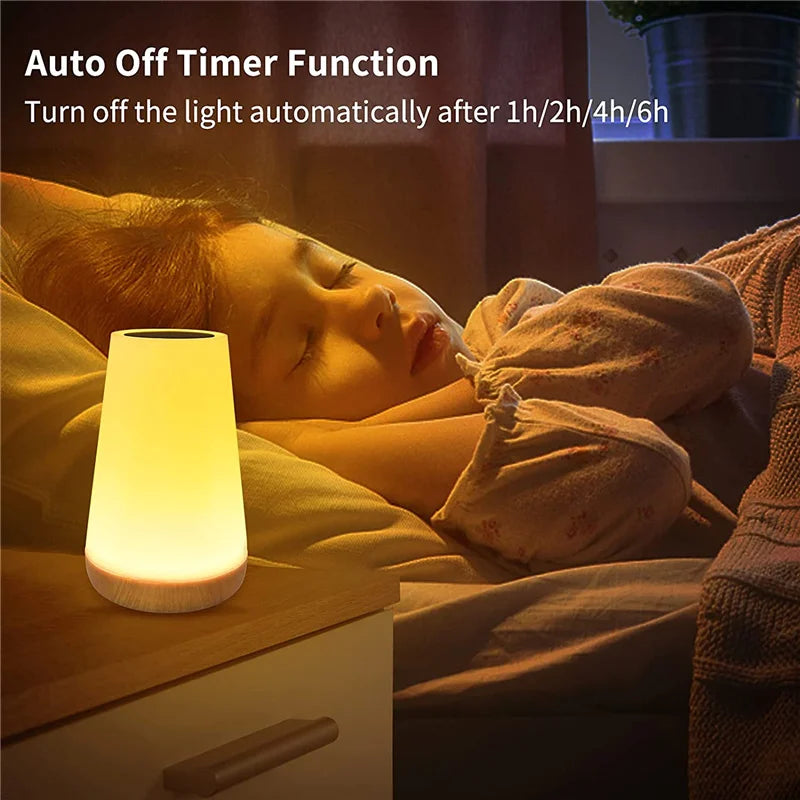 Child sleeping beside a glowing color-changing night light with auto-off timer feature, set on a bedside table.