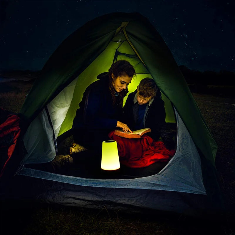 People using a 13 color-changing night light in a tent, perfect for camping and reading, rechargeable RGB lamp by OSITE SKY.